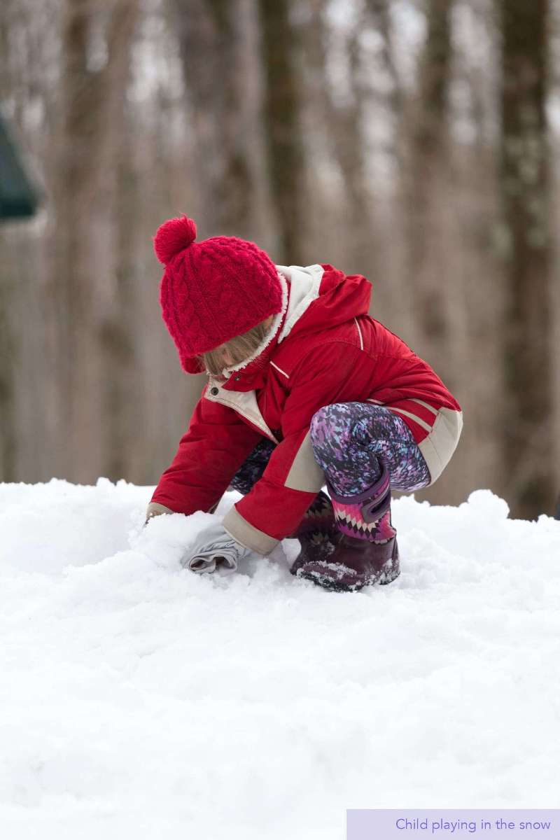 Child playing in the snow